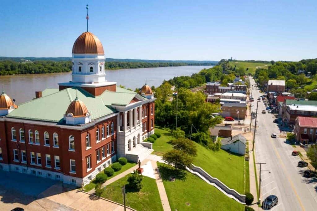 Aerial view of the Gasconade County Courthouse in Hermann, Missouri. The Missouri River flows behind the building.